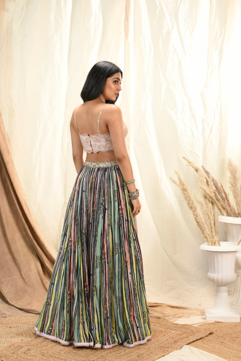 Lace bustier with cape and striped printed lehenga