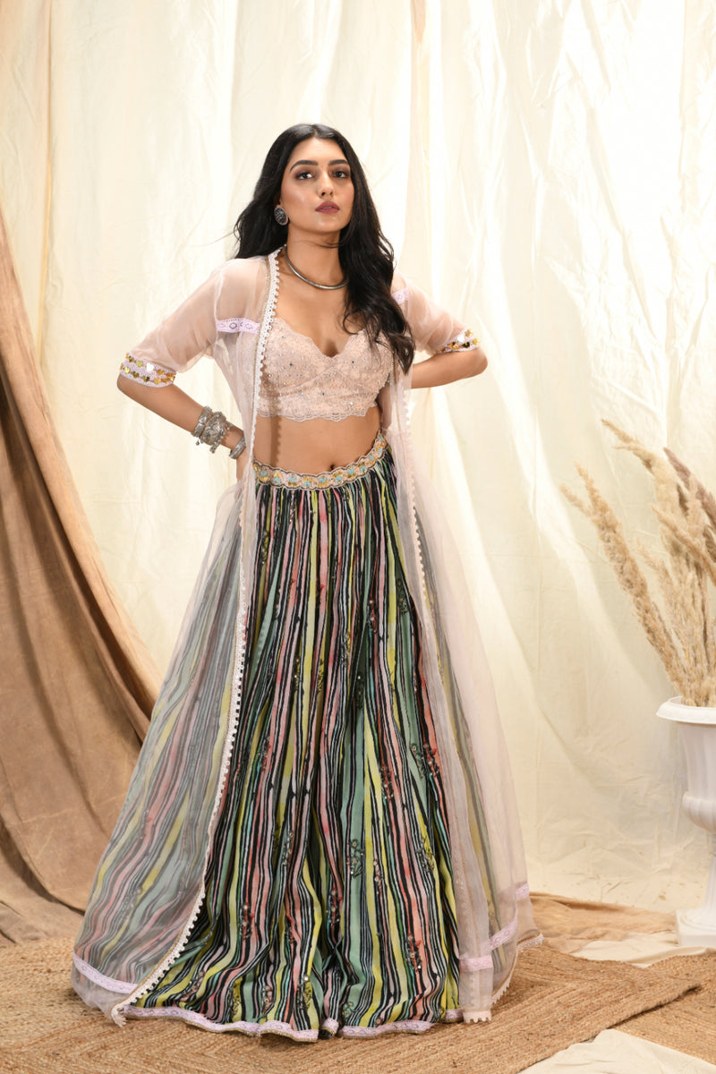 Lace bustier with cape and striped printed lehenga