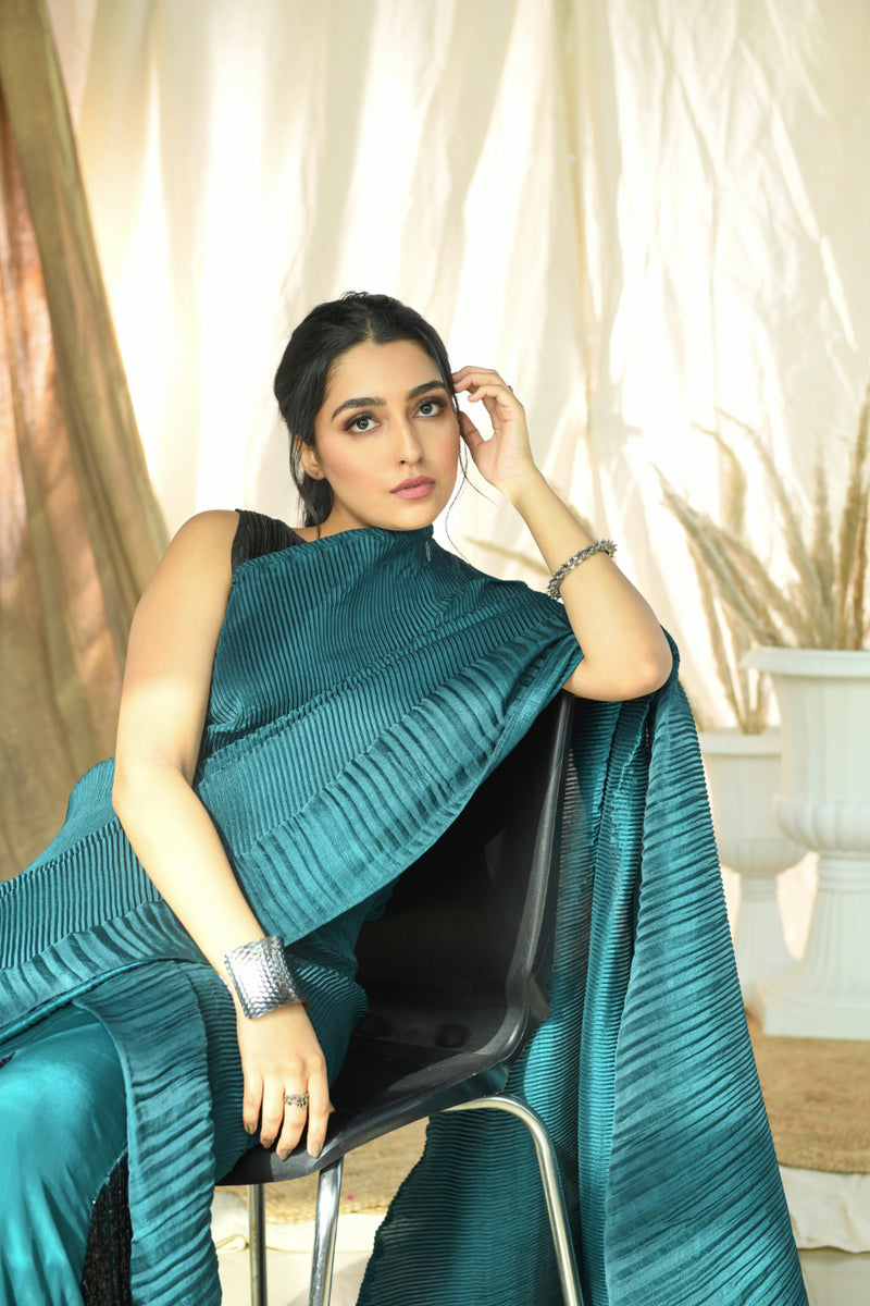 Teal pleated fringe saree with pleated embroidered blouse