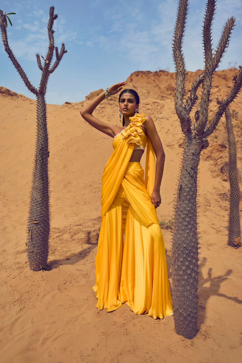 Draped Saree With Cones On Palla And One Shoulder Blouse
