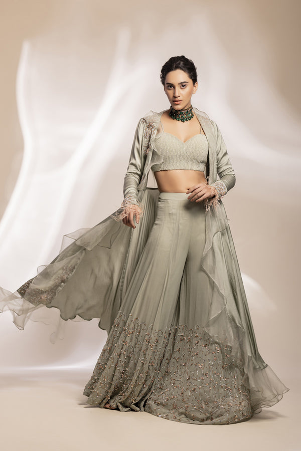Sage Green Modal Silk Jacket With 3D Motifs And Sheer Ruffle, Paired With Flared Sharara.