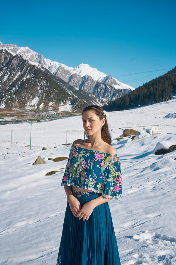 navy blue floral hand emdroiderd off sholulder cape blouse with pleated lehanga made in georgette fabric