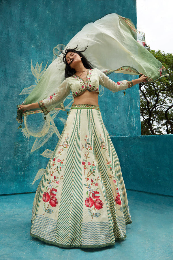 Beige printed lehenga set ornamented with embroidery neckline ,chiffon sleeves and printed organza dupatta