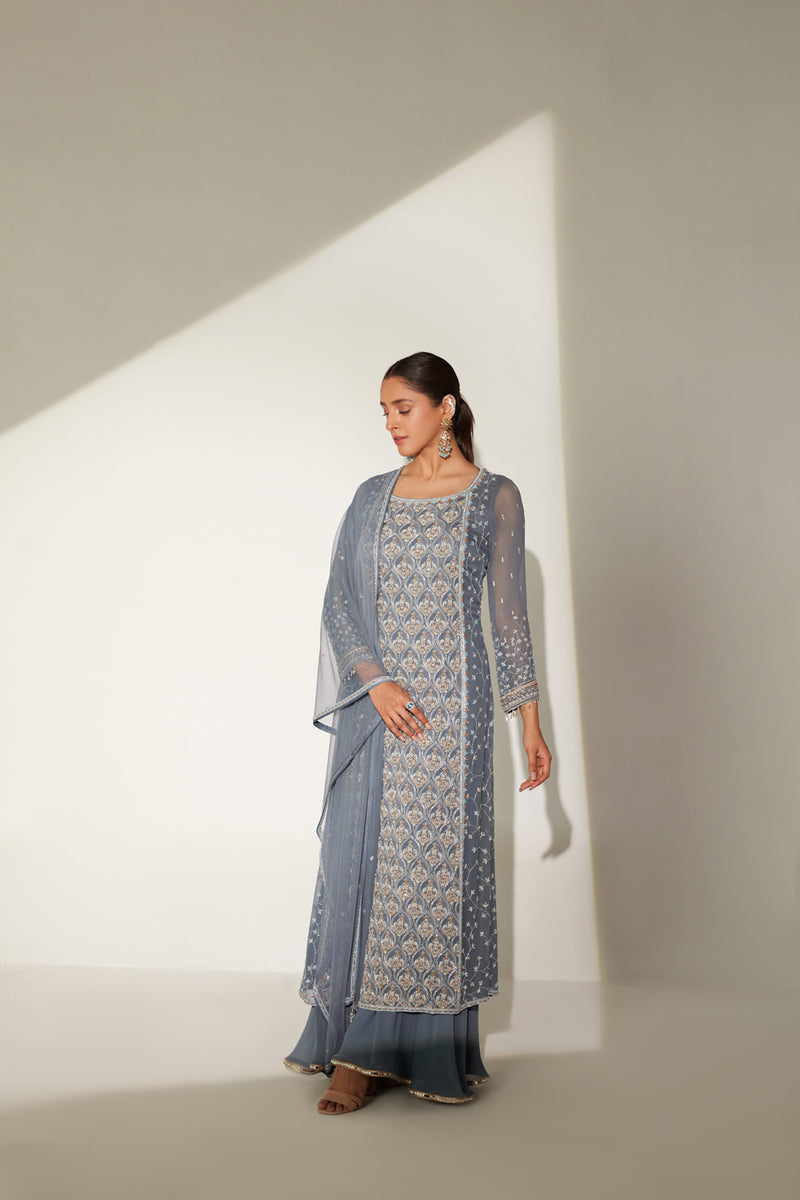 Boat neckline long tunic paired with gathered sharara and soft dupatta