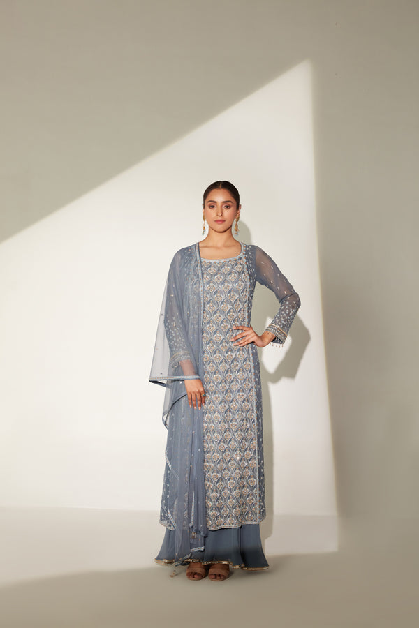 Boat neckline long tunic paired with gathered sharara and soft dupatta