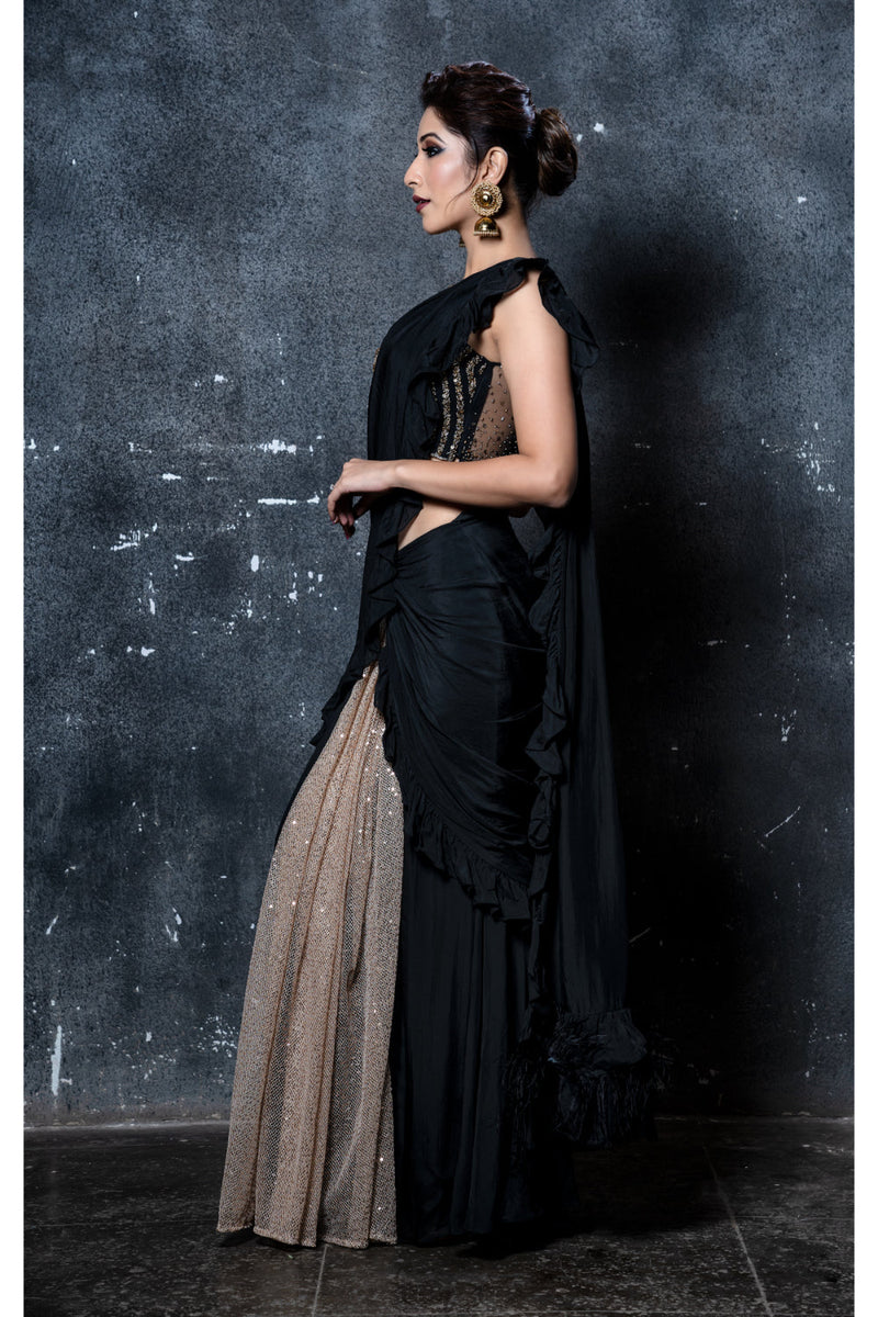 Black stitched ruffles saree with gold shimmer pleats & feathers with black & gold leather applique embroidered blouse