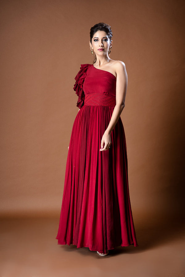 Red pure crepe one shoulder gown with ruffled sleeve & self thread embroidery