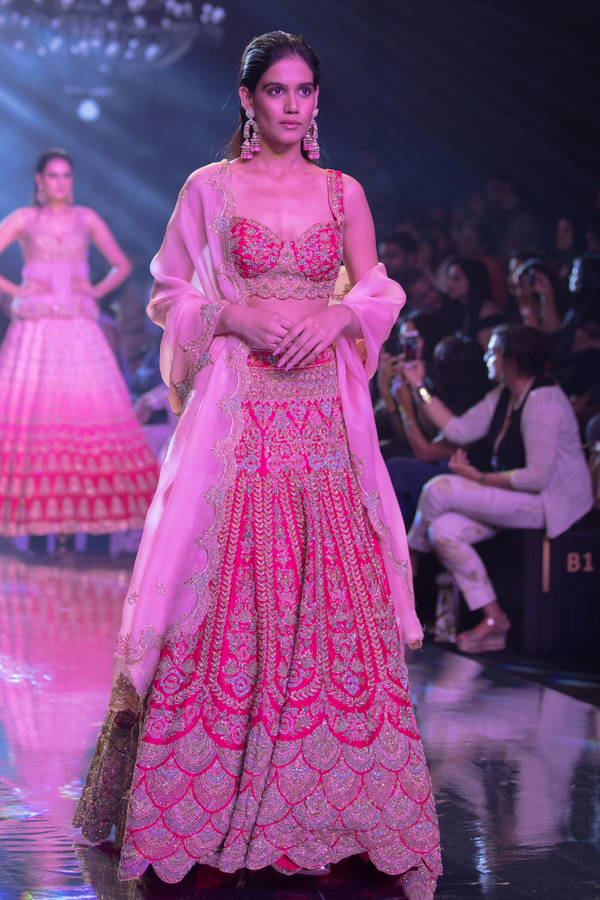 Fuschia Rose Lehenga Choli With Heavy Embossed Floral Embroidery In Kali Pattern
