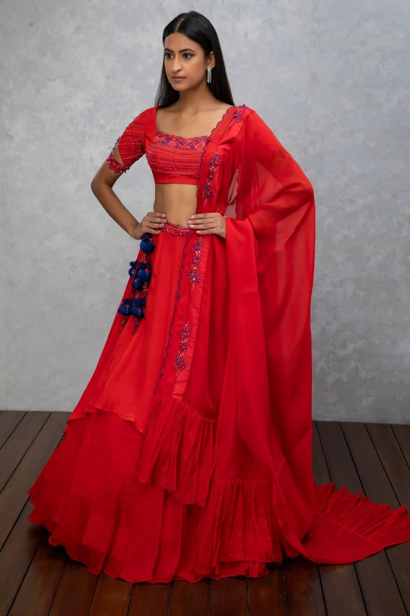 Amber orange crepe and organza layered lehenga set