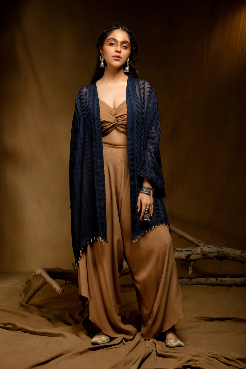 Golden beige front knot bustier with dhoti pants and navy blue cape