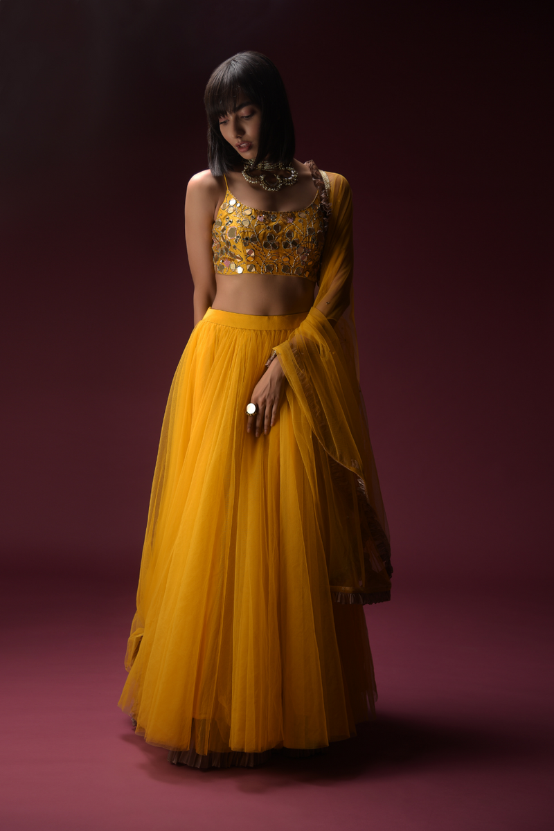 Tuscan Sun Yellow Skirt And Crop Top Set With Heavy Hand Embroidery Work Using Flower And Leaf Shaped Mirrors
