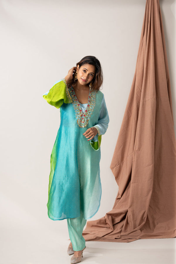 Falling Raw Silk Mukaish Fabric With Hand Embroidered Neck And Sleeves, Includes A Pant