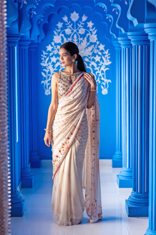 Ivory printed saree with embroidered blouse
