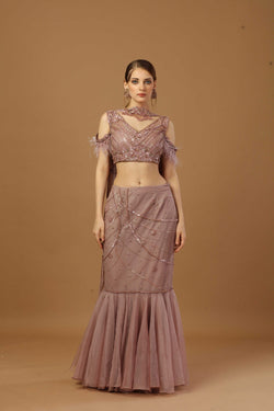 Fish Cut Skirt With Matching Tonal Blouse And A Narrow Neck Dupatta.