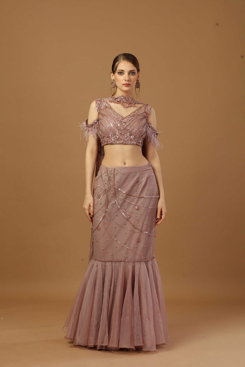 Fish Cut Skirt With Matching Tonal Blouse And A Narrow Neck Dupatta.