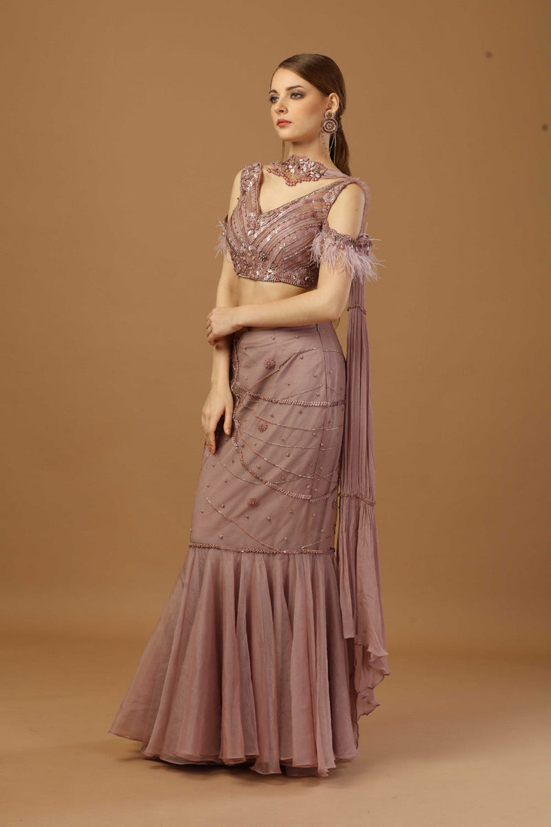 Fish Cut Skirt With Matching Tonal Blouse And A Narrow Neck Dupatta.