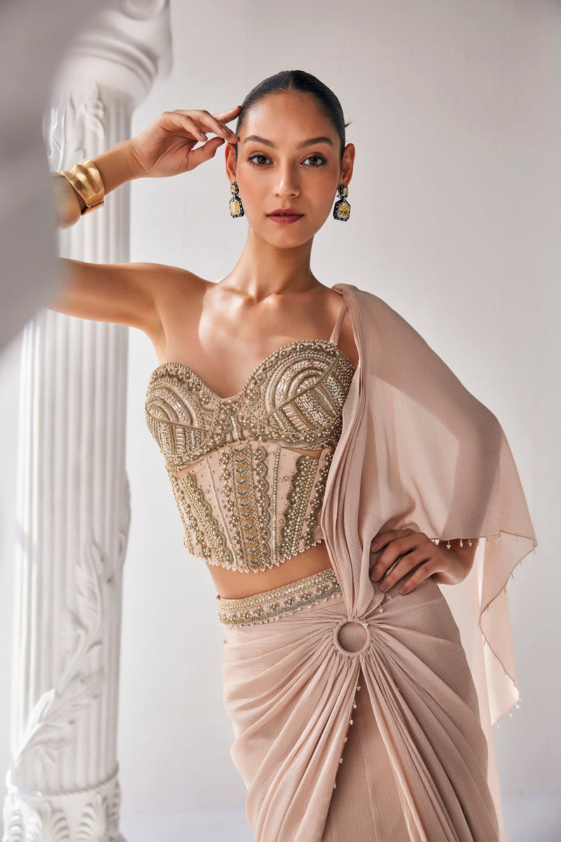 Draped Saree In Metallic Shimmer Chiffon Fabric With Intricate Embroidery Detail In The Corset Along With An Embroiderd Belt.