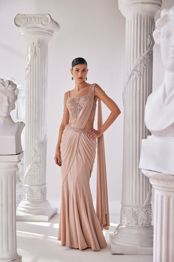 Peach Draped Saree In Luxurious Shimmer Lyrcra. It Is Paired With Anembroidered Corset Blouse And Highlighted With A Statement Belt.