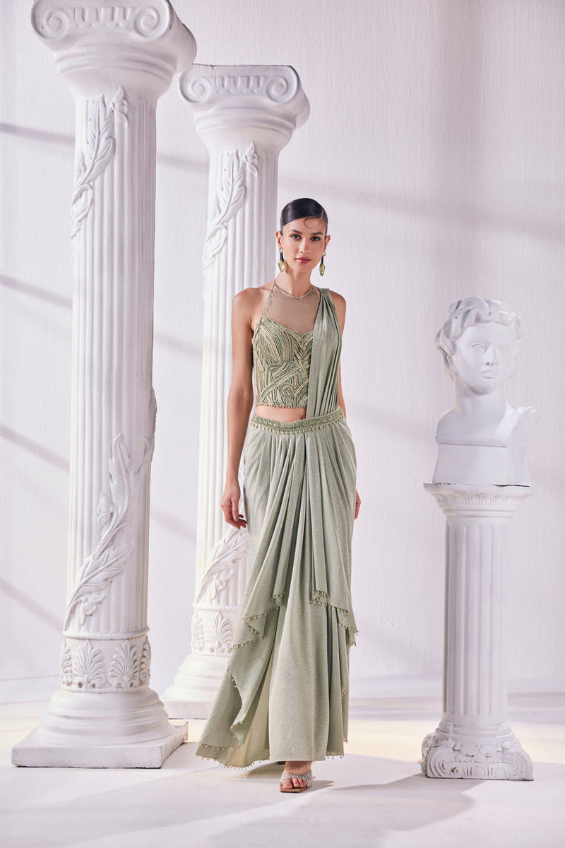 Jade Green Draped Saree In Luxurious Shimmer Lycra Paired With Anemroidered Corset And A Belt.