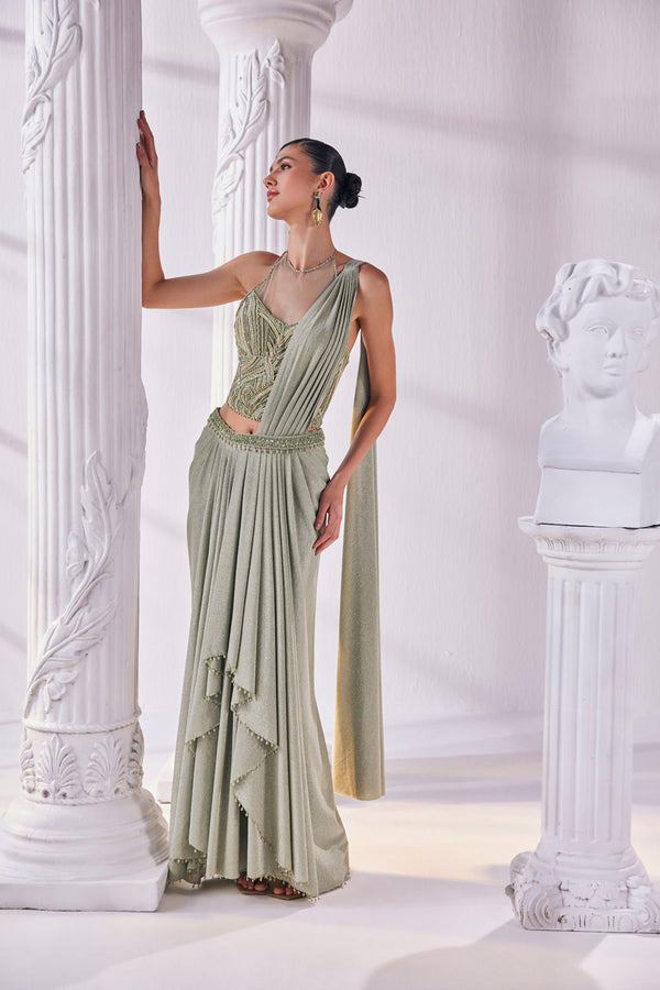 Jade Green Draped Saree In Luxurious Shimmer Lycra Paired With Anemroidered Corset And A Belt.