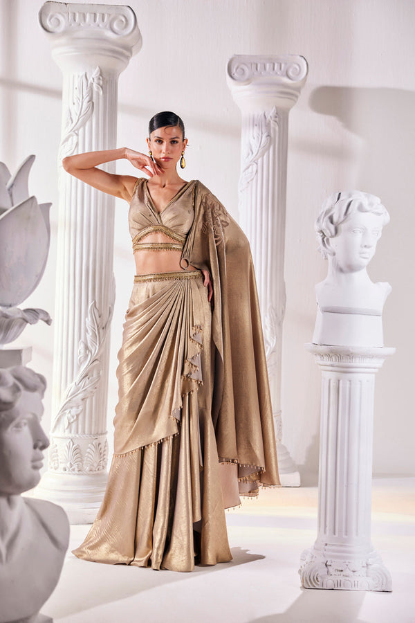 Mettalic Antique Gold Drape Saree With An Embellished Belt. It Is Paired With A Luxurious Metallic Blouse.