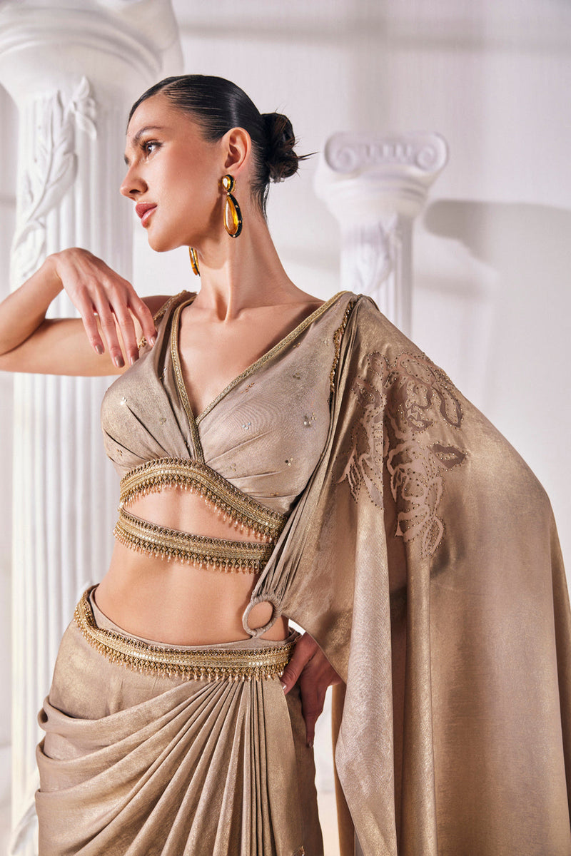 Mettalic Antique Gold Drape Saree With An Embellished Belt. It Is Paired With A Luxurious Metallic Blouse.