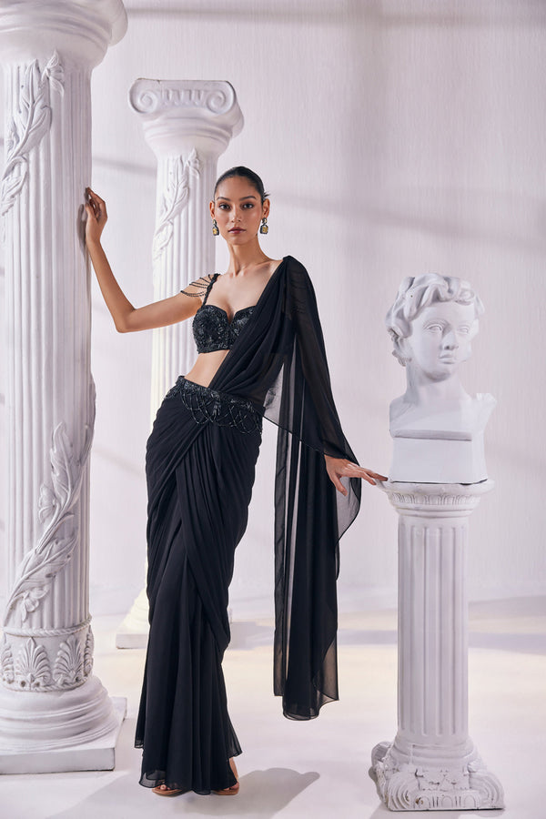 Draped Saree In Royal Georgette Fabric Designed With An Embroidered Bustier And A Statement Belt.