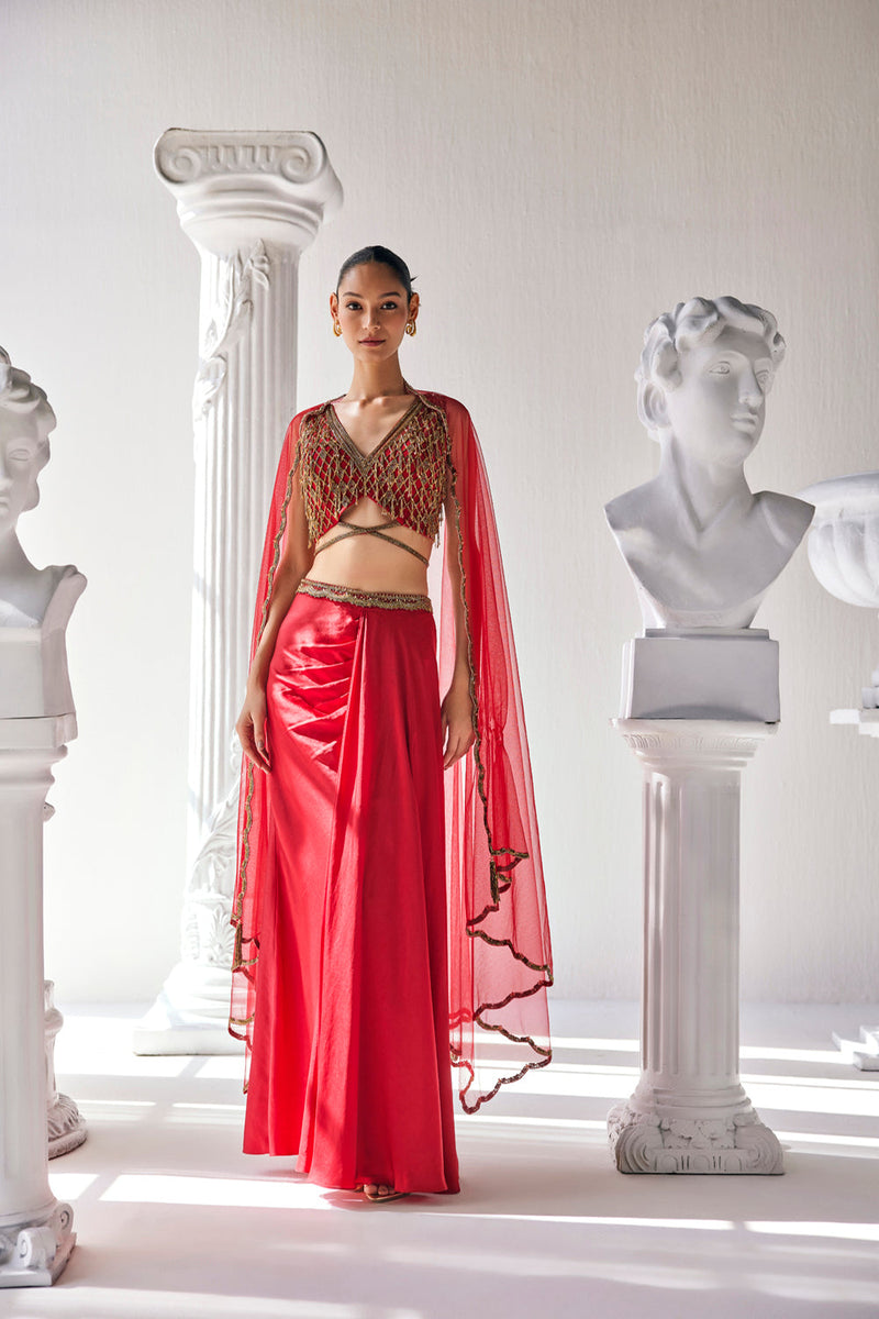 Elegant Red Ensemble Features A Royal Satin Skirt, Fully Embroidered Blouse, Belt And A Cape In A Soft Net.