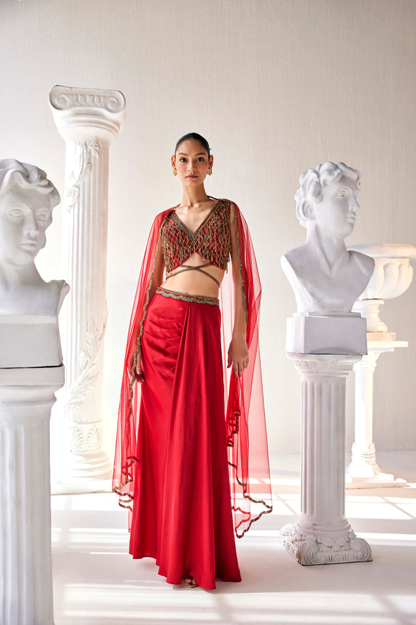 Elegant Red Ensemble Features A Royal Satin Skirt, Fully Embroidered Blouse, Belt And A Cape In A Soft Net.