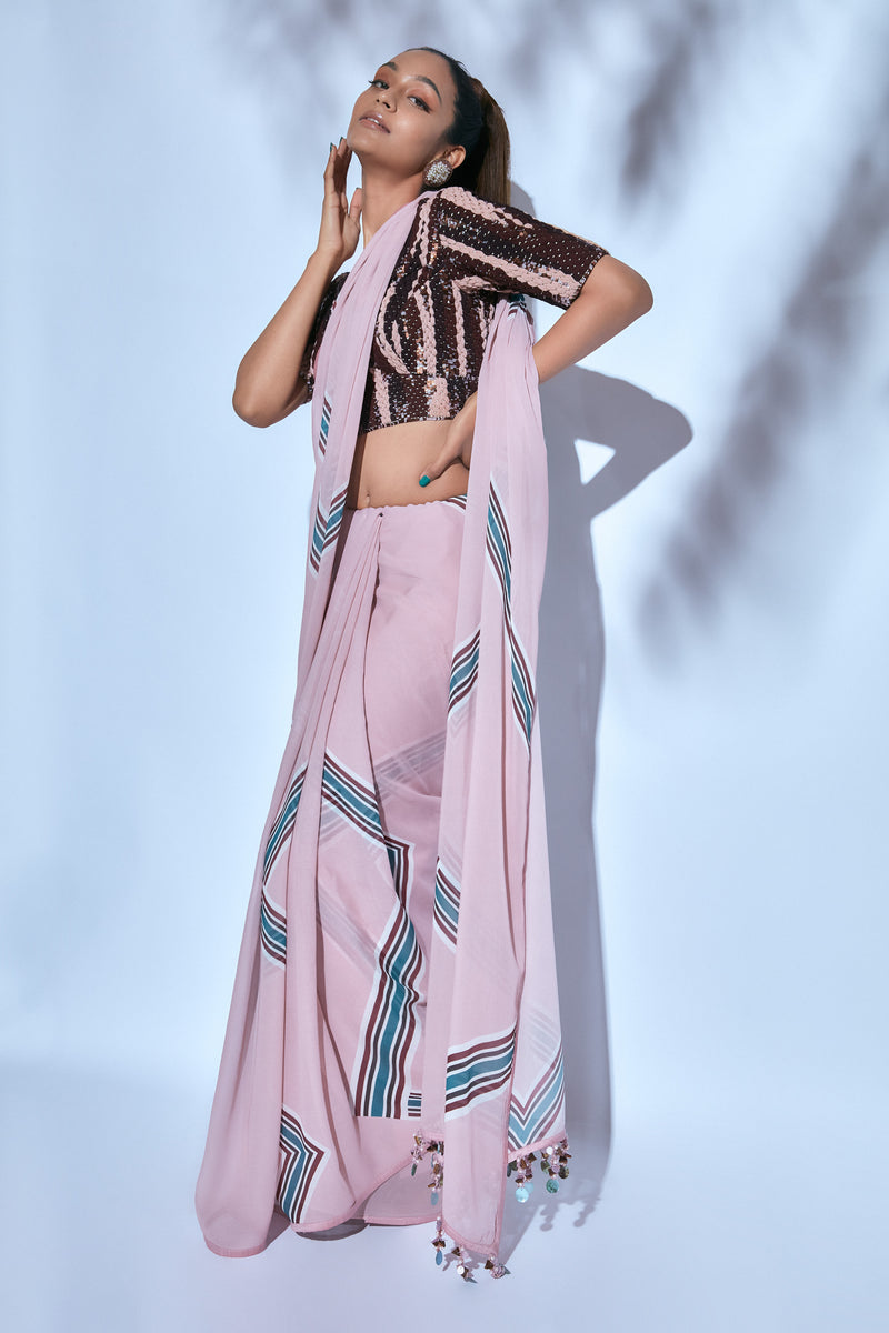 Printed Sari paired with Hand-embroidered Brown and Pink Blouse