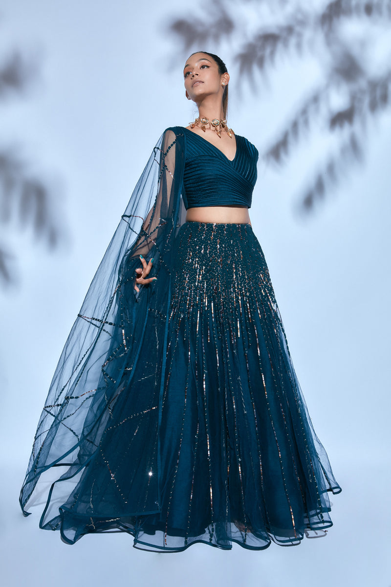 Teal Blouse paired with Teal Hand-embroidered Lehenga and Teal Hand-embroidered Dupatta