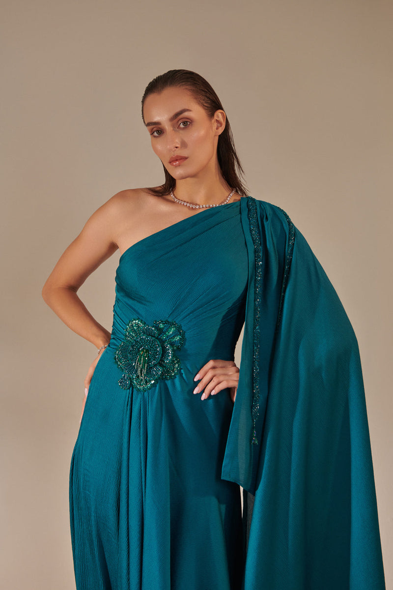 Teal One Shoulder Drape Gown ; Hand Embroidered 3D Shells At Waist, 3 Hand Embroidered Chains At The Sleeve; Asymmetric Open Drape  Sleeve